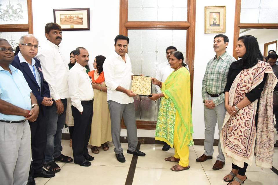 Minister KT Rama Rao presents the loan sanction letters for 16 Women entrepreneurs
